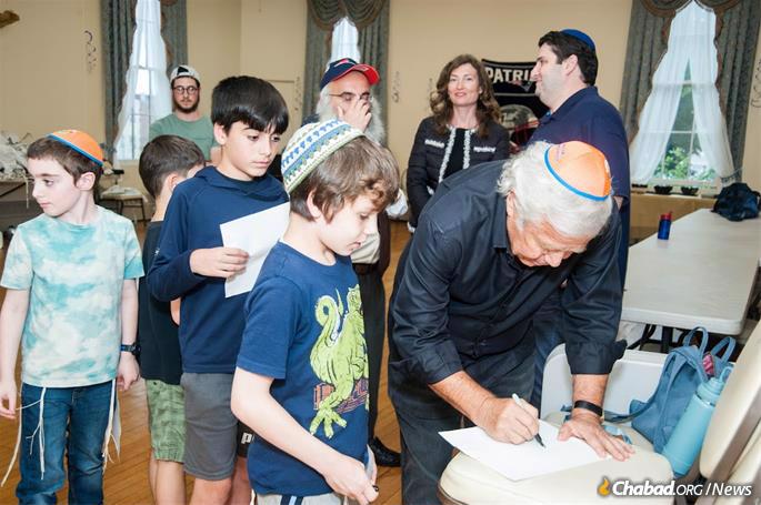 The effort saw people from around the world contribute more than $1 million in honor of the heroic rabbi, including prominent Boston-area Jewish philanthropist Robert Kraft, who personally contributed $250,000 towards the new campus. (Credit: Olga Mariotti)