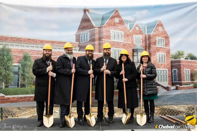 The groundbreaking for the Michael S. Maling Chabad of Illinois headquarters. From left are Rabbi Eliyahu Rapoport, Rabbi Baruch Epstein, Rabbi Yosef Moscowitz, Rabbi Meir Moscowitz, Mrs. Esther R. Moscowitz and Alderman Debra Silverstein.