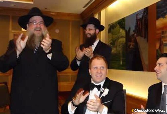 Standing, from left: Rabbi Daniel Moscowitz and his son, Rabbi Meir Shimon Moscowitz