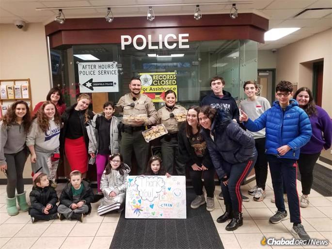CTeen of Deerfield gives back to the community, baking cookies for the Deerfield Police Department.