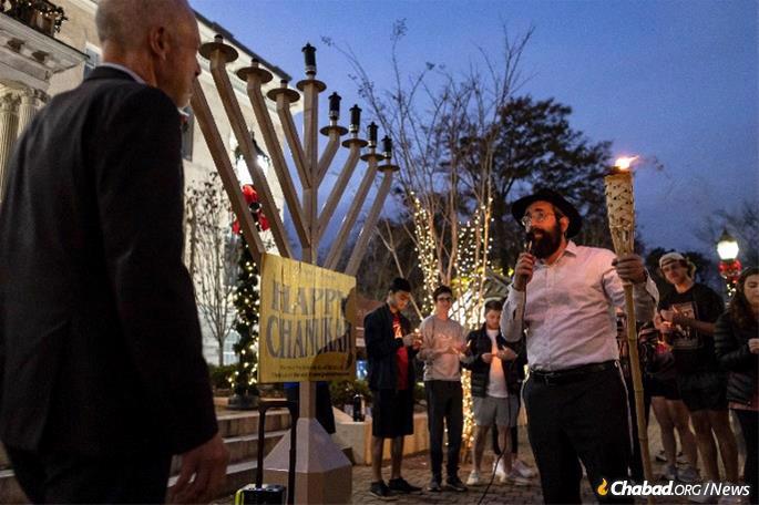 Rabbi Michoel Refson with Athens Mayor Kelly Girtz at a public menorah-lighting in front of City Hall.