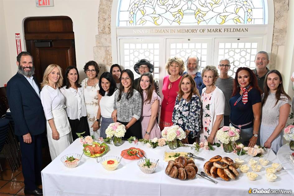 Members of the Palm Beach Synagogue’s Tanya study group gather with family and friends to celebrate the historic publishing of a beautiful new edition that has transformed the community.
