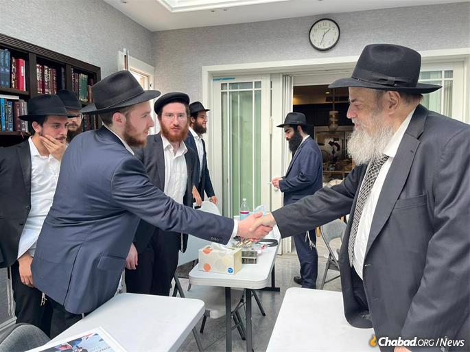 In New York, Rabbi Moshe Kotlarsky sends off rabbincal students to help Ukranian Jews this holiday season.