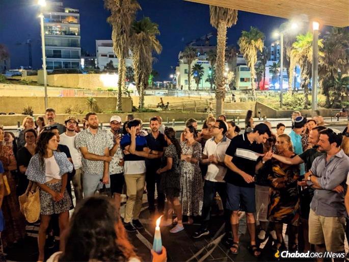 A seaside Havdalah service at Chabad on the Coast in Tel Aviv, which has grown tremendously in just a few years, attracting Jews of all ages and backgrounds. Using a dues-free model, they have outgrown their current center and are renovating a 1930s synagogue in the heart of the city, rarely used in recent decades, that had been founded by Austrian Jews who had fled to Israel.