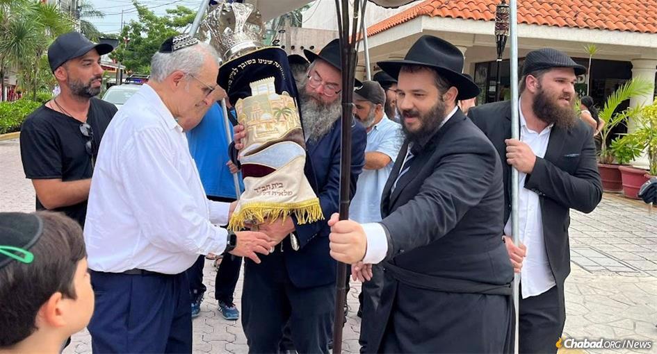 Residents and visitors to Playa Del Carmen, Mexico,Jewish community welcomed their very first Torah scroll few months ago, and will be dancing with the Torah once again next week on the holiday of Simchat Torah.