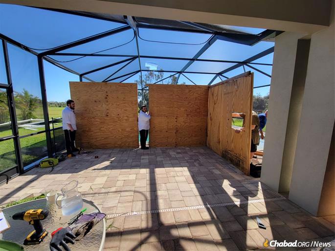 Building the sukkah at Chabad of Venice, Fla.