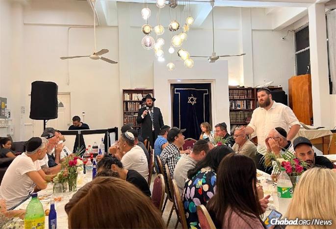 As tourists in search of services and meals, the Sousana family from France arrived at the Chabad center one Shabbat, where they found a packed dining hall and not a single empty chair. They sat on the floor with their chidren, ate the Shabbat meal and pledged to donate a Torah scroll to the center, which had been using a borrowed scroll.