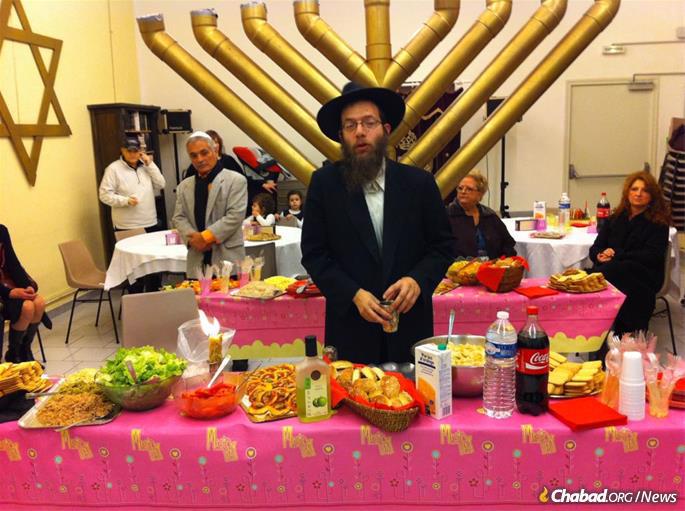 The rabbi hosts a Chanukah celebration in his early years in Perpignan.