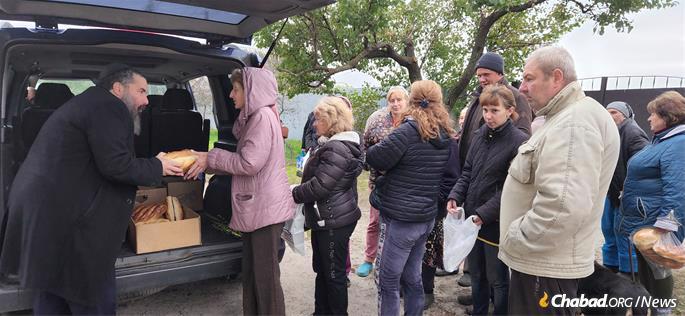 Distributing bread to the needy.