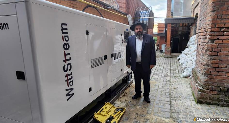 Rabbi Moshe Moskovitz in Kharkov with a new electric generator for the Chabad Center provided by the Jewish Relief Network Ukraine (JRNU).