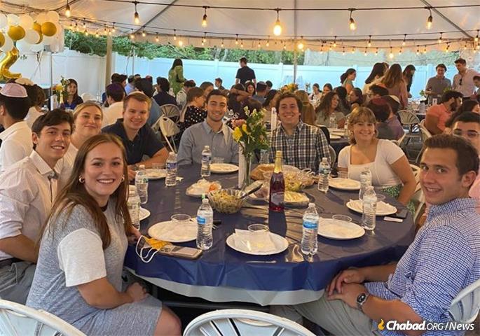 A big and open Shabbat dinner, like the one above at Wash U., is imbued with Jewish culture and is accessible to people with no previous background or experience celebrating Shabbat.