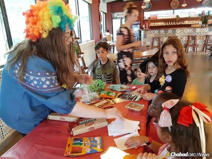  As everywhere, children in Zambia will be a focus of Chabad’s work. Rivkah Hertzel with local Jewish kids on Purim, more than 50 years after Yerachmiel Glazer had the country&#39;s only Megillah shipped in from Israel.