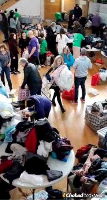 Volunteers and donors bring clothing to the Mill Hill synagogue in London.