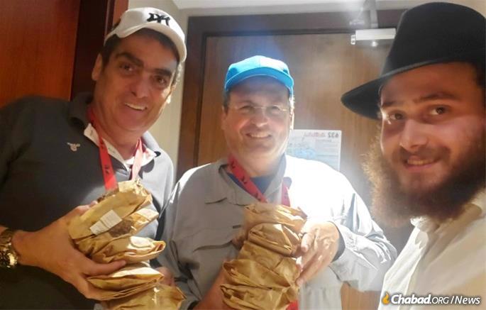 Chitrik supplies Bercho and Toby Frydman with kosher sandwiches.