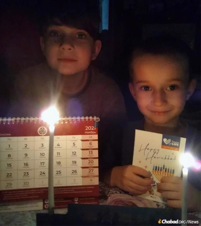 The younger two children of Elena Bessanova last Chanukah.