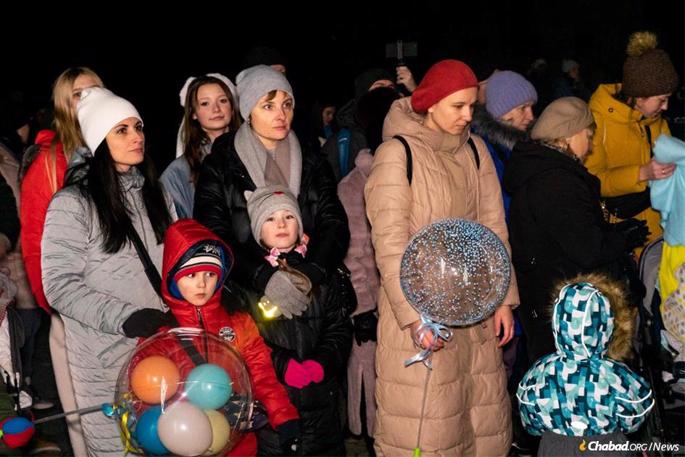 Hundreds of Jewish residents and refugees gathered for the menorah lighting in Uzhgorod, along the Slovakian border in the nation’s west.