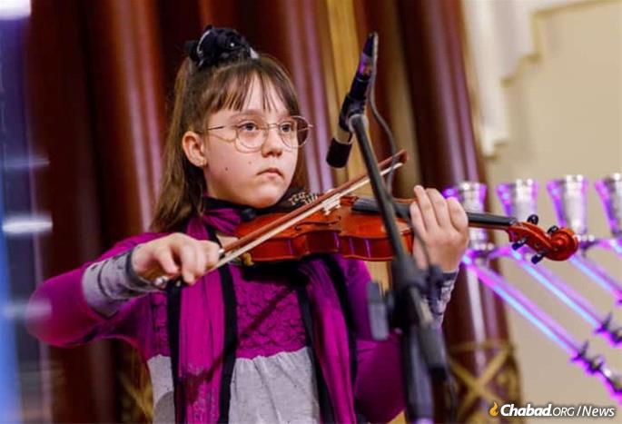 Artur's sister Katya played the violin for the 500 in attendance.