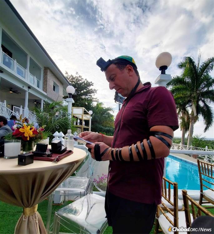 The celebration afforded many men the opportunity to don tefillin and say a quick prayer.