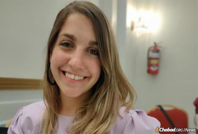 Melanie Siddig of Buenos Aires, Argentina, is volunteering at a festive holiday meal for some 200 Jews in need.