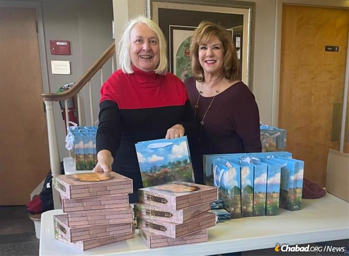Carol Kurtzer of Franklin Lakes, N.J., right, has already started ringing doorbells to deliver some of the community’s Purim baskets.
