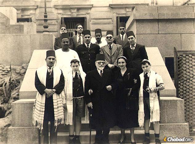 Two bar mitzvah boys and their proud family members outside the Shaar Hashamayim synagogue in Cairo