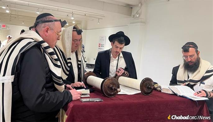 During the fair, as many as 100 Jews gather daily for prayers and meals, while many others stop by to put on tefillin, schmooze or hear a quick Torah thought before heading to their next meeting.