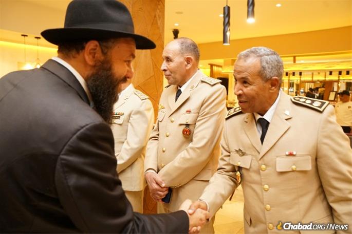 Rabbi Levi Bannon greets Moroccan dignitaries - Photo by Avi Winner/Merkos 302