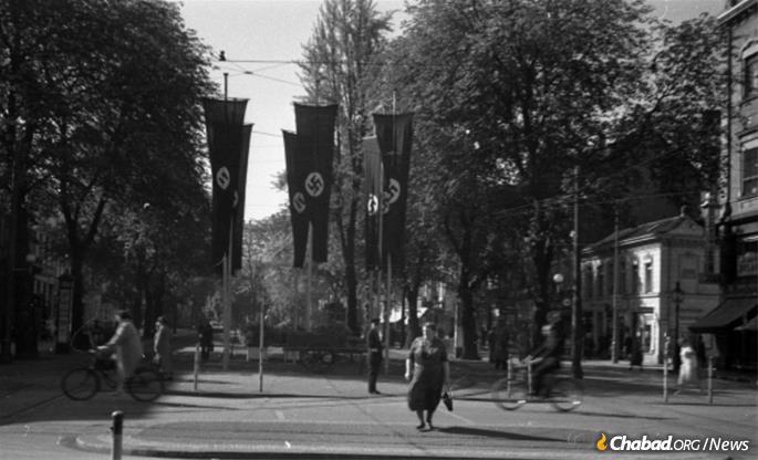 Nazi banners in the streets of Krefeld, Germany, in the late 1930s. Within a few years, the city&#39;s remaining Jews were transported to concentration camps.