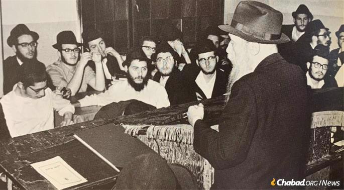 Rabbi Chaim Mordechai Aizik Hodakov, the Rebbe's chief secretary, addresses students at the Central Lubavitcher Yeshivah in Brooklyn, mid-1970s.