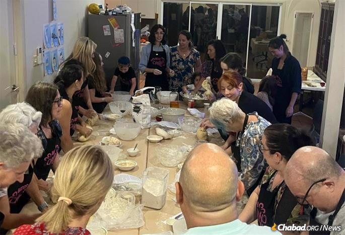 People gather for a challah bake in North Queensland, Australia.