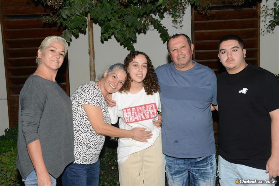 Pvt. Ori Megidish, 19, center with her family following her rescue by the Shin Bet and Israel Defense Forces. - Credit: Shin Bet.