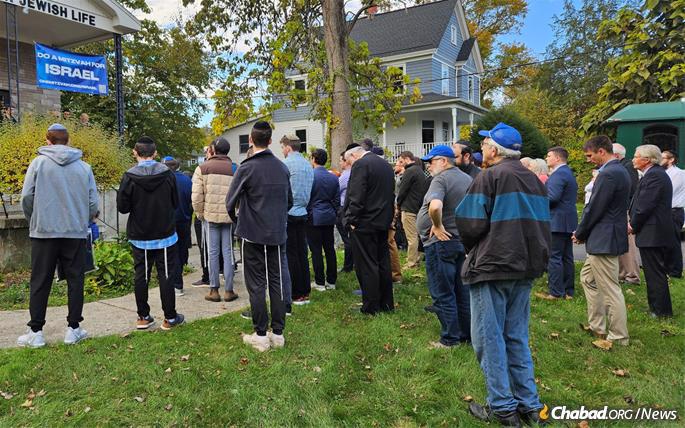 Throughout the week, hundreds made the trek to Kingston to comfort Shnaider, some driving hours to be there with him and his family. - Photo: Bruce Tuchman