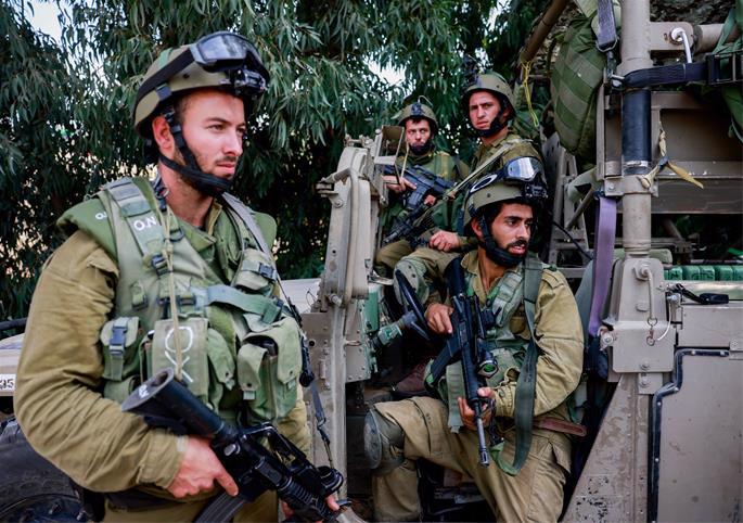 Israeli soldiers seen on a road near the Israeli-Gaza border, in southern Israel, October 10, 2023. - Photo by Chaim Goldberg/Flash90