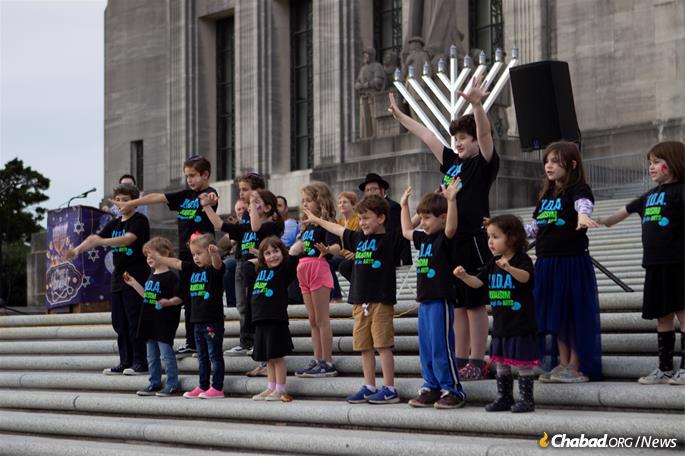 Jewish children from Baton Rouge celebrate Chanukah in front of the Louisiana State Capitol.