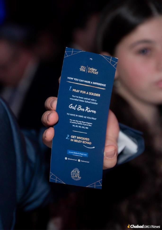 Guests received bookmarks with the name of a wounded soldier to pray for; about 2,000 Israeli soldiers have been injured since Oct. 7. - Photo by Rebecca Howard