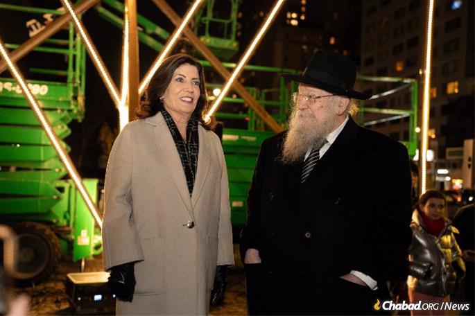 New York Gov. Kathy Hochul with Rabbi Shmuel Butman at the 5th Ave. Menorah lighting in Manhattan. - Credit: Lubavitch Youth Organization