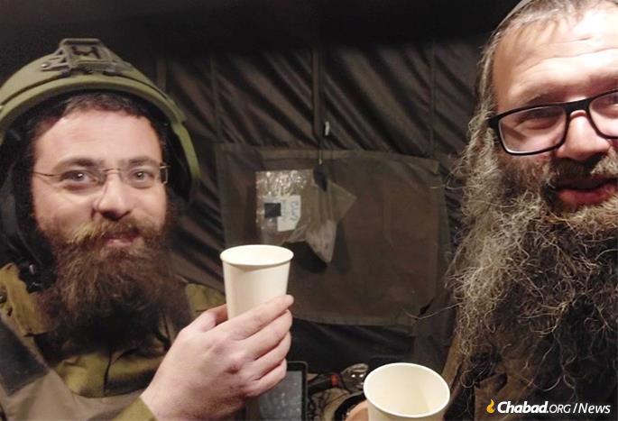 Rabbi Menachem Offen and Morgenstern celebrate the printing.
