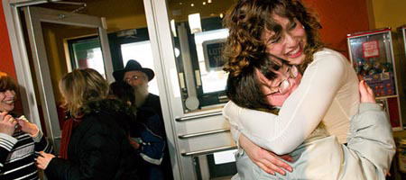 A volunteer welcomes one of the participants of Friendship Circle in Montreal, Canada, to one of their specially-designed programs. The Friendship Circle of Montreal, part of an international Chabad-Lubavitch initiative, promotes socialization between children with special needs and teens. Photo: Menachem Serraf
