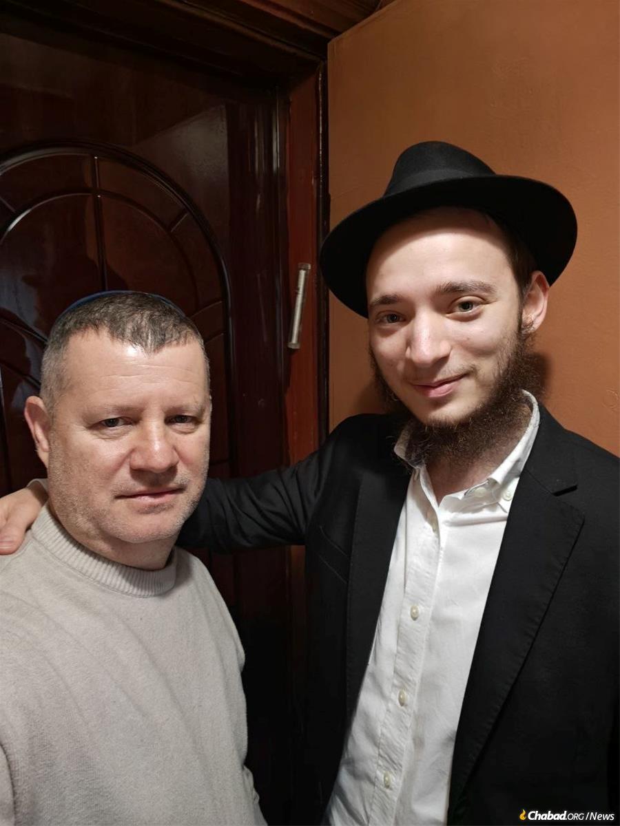 Putting a mezuzah on the door of a Jewish home.