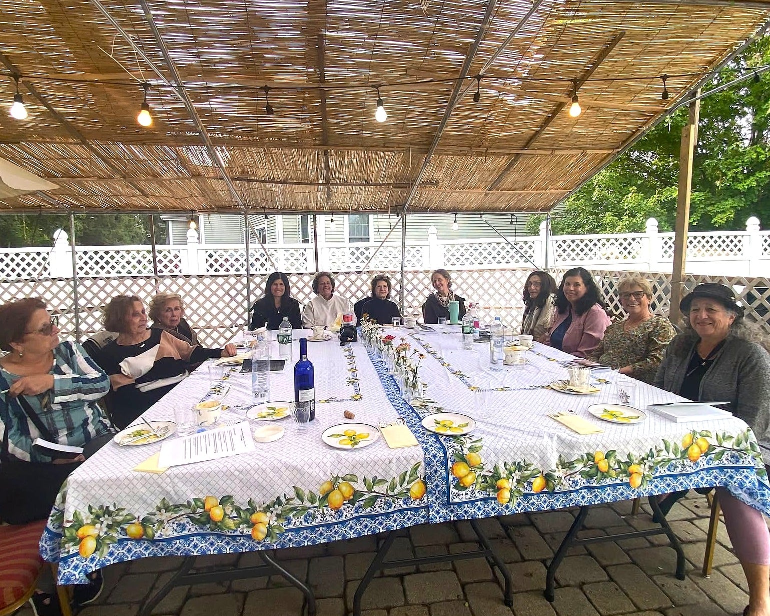 Women sharing conversation around a table at a community gathering