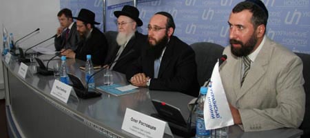 Chief Rabbi of Ukraine Azriel Chaikin, center, joined Jewish community leaders at a press conference calling for the country to release seized Torah scrolls.