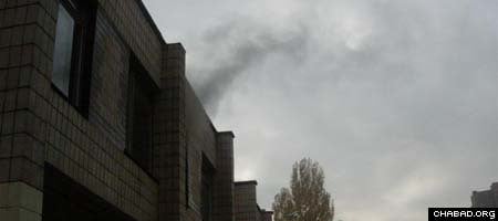 Smoke escapes from a window at Kiev&#39;s Simcha School.
