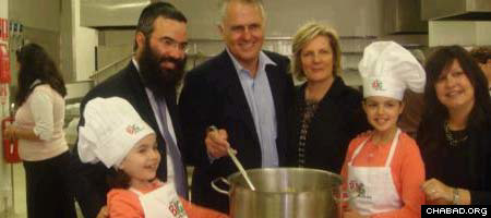 MP Malcolm Turnbull at the new kitchen with young volunteers