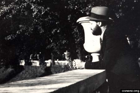 The Rebbe, Rabbi Menachem Mendel Schneerson, of righteous memory, looks out over a bridge at the Jardin du Luxembourg park in Paris in this picture from the 1930s. The Agudas Chasidei Chabad library, headed by Rabbi Sholom Ber Levine, released the picture for use by Jewish Educational Media. (Photo: Jewish Educational Media)