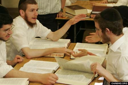 Students in the yeshiva portion of the Detroit school debate issues in Jewish law. They also study Talmud and Chasidic philosophy, but dedicate their free time to helping others in the wider community.