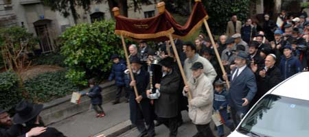 A Torah procession down a street in Basel, Switzerland, marks the dedication of a new Chabad-Lubavitch center in the city. (Photos: Meir Dahan)