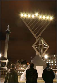 The Chabad House of Hendon’s Chanukah menorah at London’s Trafalgar Square lights up the night sky. Nelson’s Column is in the background.