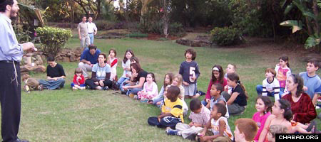Chabad-Lubavitch rabbinical student Chananya Rogalsky teaches Jewish kids during a summer visit to Nairobi, Kenya.