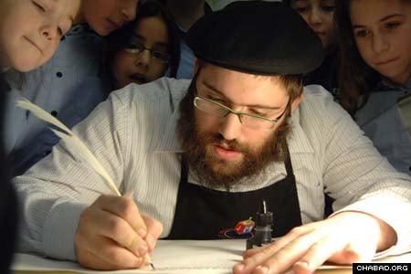 Children gather around scribe Rabbi Benny Hershkowitz as he carefully pens a letter during the hands-on demonstration “Torah Unwrapped” at the Jewish Children’s Museum in Brooklyn, N.Y. The public exhibit takes place every Sunday until March 2 at the Chabad-Lubavitch institution. (Photos: Todd Maisel/The Daily News)