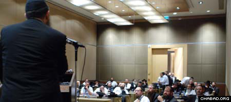 Chabad-Lubavitch emissaries in Brazil listen to a presentation during a conference on Jewish outreach.